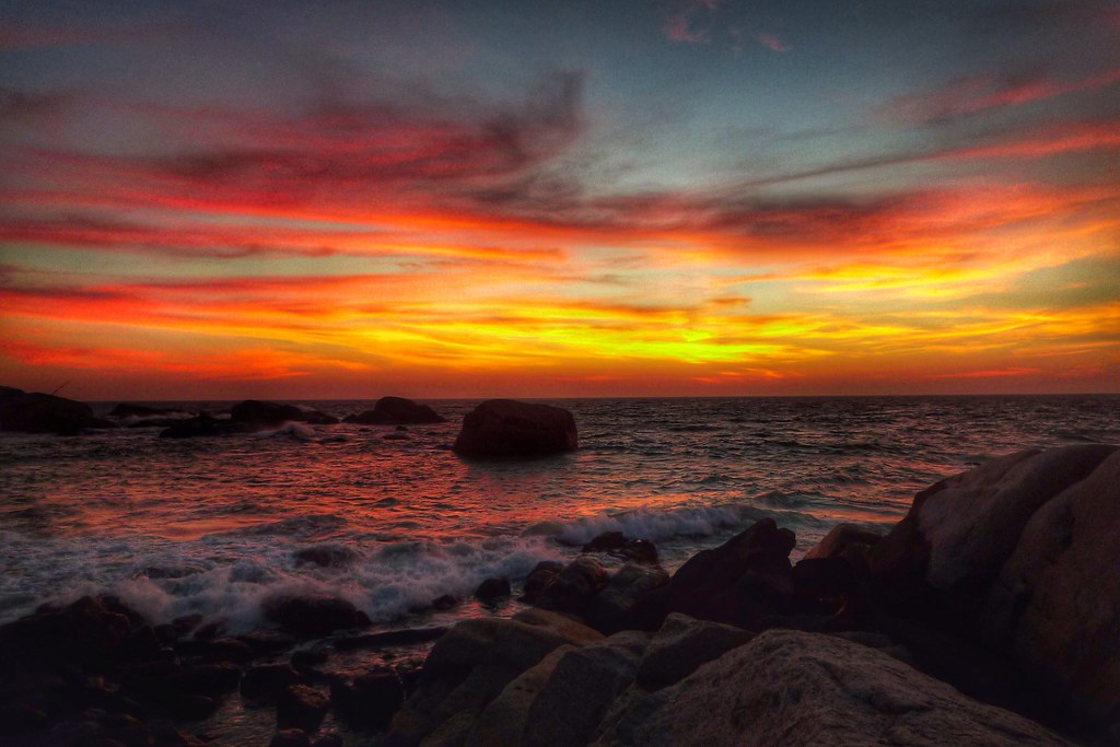 Breathtaking golden sunset over the ocean at Cape Comorin, Kanyakumari